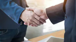 two men shaking hands merger acquisition