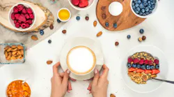 breakfast background with oatmeal coffee, berries, egg, nuts, coffee