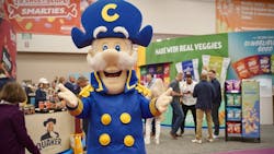 The Quaker mascot welcomes guests at the 2024 Sweet & Salty Expo. The Quaker mascot welcomes guests at the 2024 Sweet & Salty Expo.