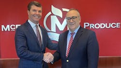 John P. Olivo, president of Fresh Express, and Carter McEntire, the newly appointed vice president of foodservice for Express, shake hands following the successful acquisition of McEntire Produce by Fresh Express. John P. Olivo, president of Fresh Express, and Carter McEntire, the newly appointed vice president of foodservice for Express, shake hands following the successful acquisition of McEntire Produce by Fresh Express.