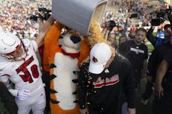 Jaiden Spearman, left, and Tony the Tiger dump Frosted Flakes on Louisville Head Coach Jeff Brohm. Lousiville defeated Washington in the 2024 Tony the Tiger Sun Bowl. Jaiden Spearman, left, and Tony the Tiger dump Frosted Flakes on Louisville Head Coach Jeff Brohm. Lousiville defeated Washington in the 2024 Tony the Tiger Sun Bowl.