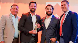 Members of the Sheehan Brothers Vending team, including company president Patrick Sheehan, center left, and company operations manager Michael Sheehan, center right, accept the 2025 Business of the Year award from the Greater Springfield Partnership.