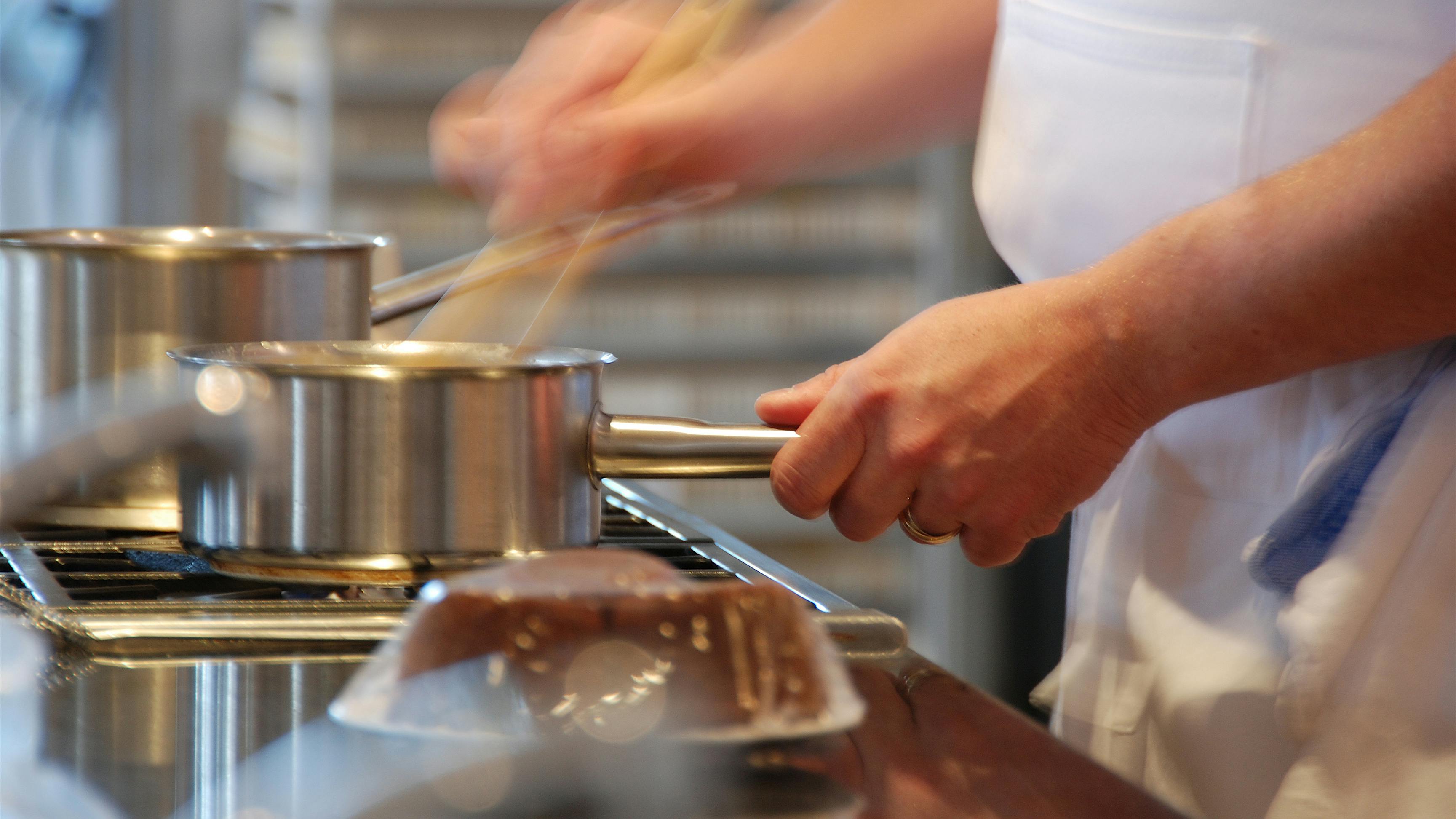 Busy Chef At Restaurant Stove