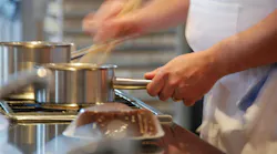 Busy Chef At Restaurant Stove