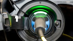 Electric vehicle charging stock image Electric vehicle charging stock image