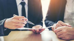 two business people negotiating a deal two business people negotiating a deal