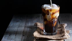 iced coffee creamer pouring into glass iced coffee creamer pouring into glass
