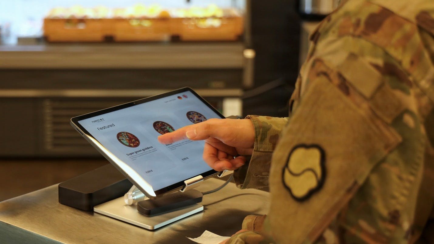 Inside Market 19 a Soldier orders a meal on Camp Walker, South Korea