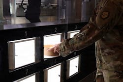 A meal is finished and picked up by a Soldier at the new autonomous kitchen on Camp Walker, South Korea A meal is finished and picked up by a Soldier at the new autonomous kitchen on Camp Walker, South Korea
