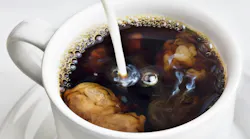 coffee into a cup of coffee stock image