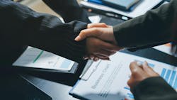 handshake across a desk handshake across a desk