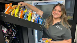 Mariah Silva, a partner at Vendo Snacks, restocks a client location. vending convenience services