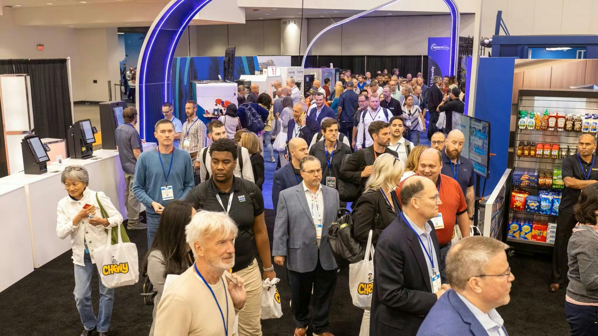 The crowd streams into Imagination Way at the 2025 NAMA Show in Las Vegas.