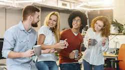 Group of Young Professionals Enjoying Coffee Break in Modern Office Space Together. Group of Young Professionals Enjoying Coffee Break in Modern Office Space Together.