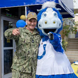 Capt. Patrick O’Neill, commanding officer of NSA Souda Bay, joins Blue, the Indiana Colts’ mascot, at the opening of the new micro market.